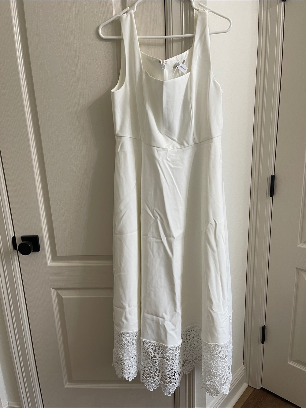 Sleeveless White Dress with Lace Hem